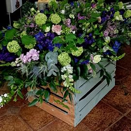 Roseum and Delphinium Natural Casket Spray